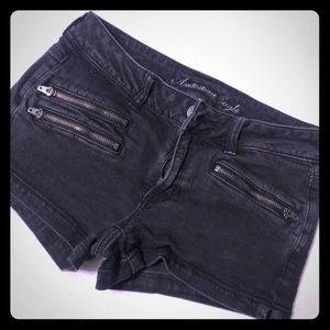 Black denim shorts with zipper pockets